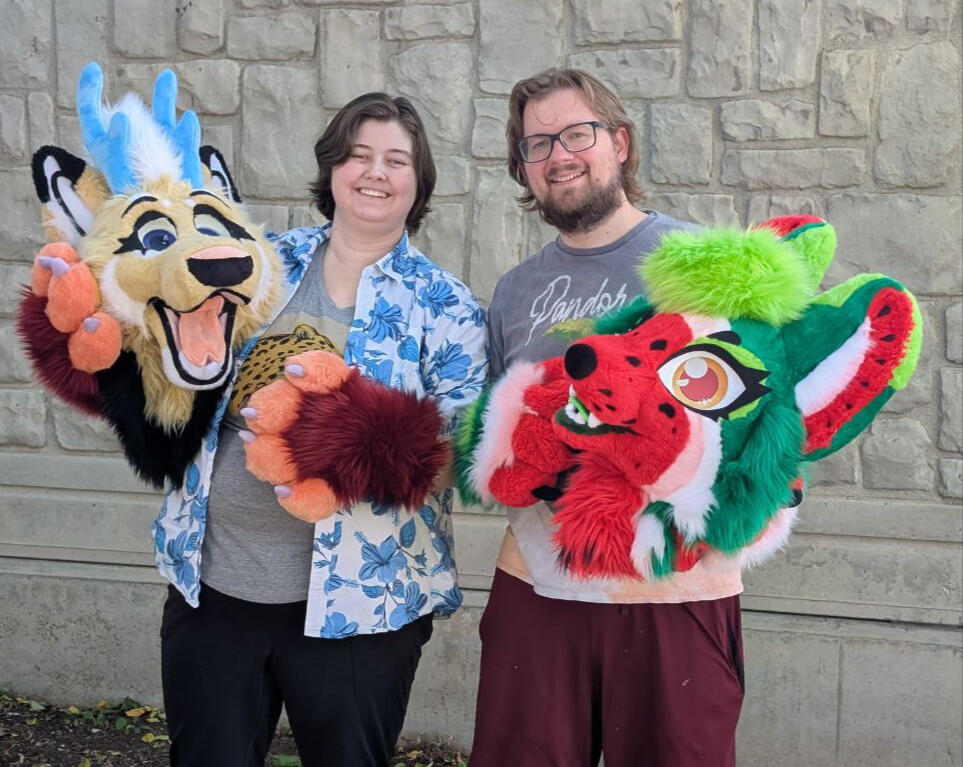 Cascade and Snarrfle outside with some fursuits